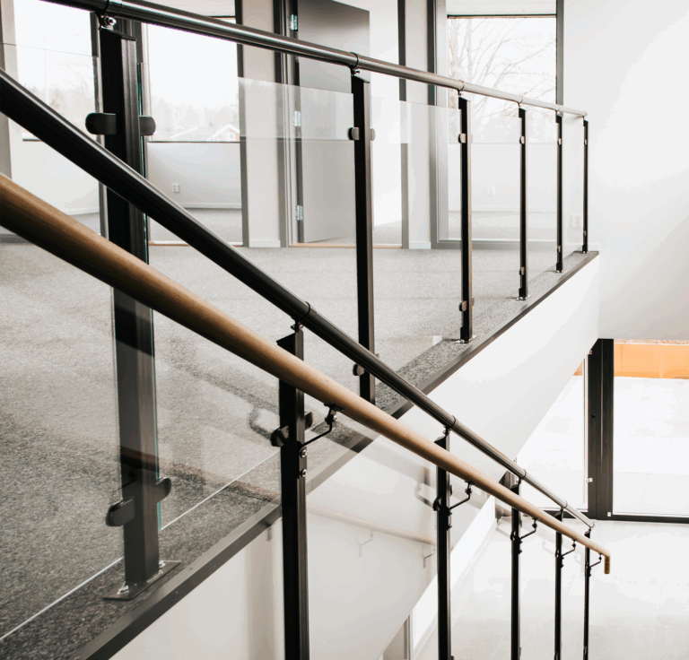 In addition to the JOS spiral staircase, Weland has also supplied a straight flight staircase with glass railing, along with a number of planters located in the courtyard (Weland Design™)